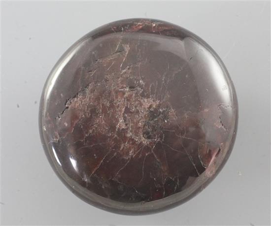 A Chinese red gem stone cabochon shaped scroll weight, diameter 5.1cm